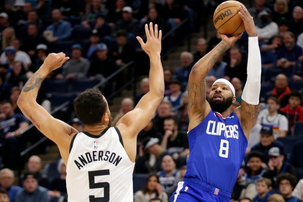 Clippers forward Marcus Morris Sr. shoots over Minnesota Timberwolves forward...